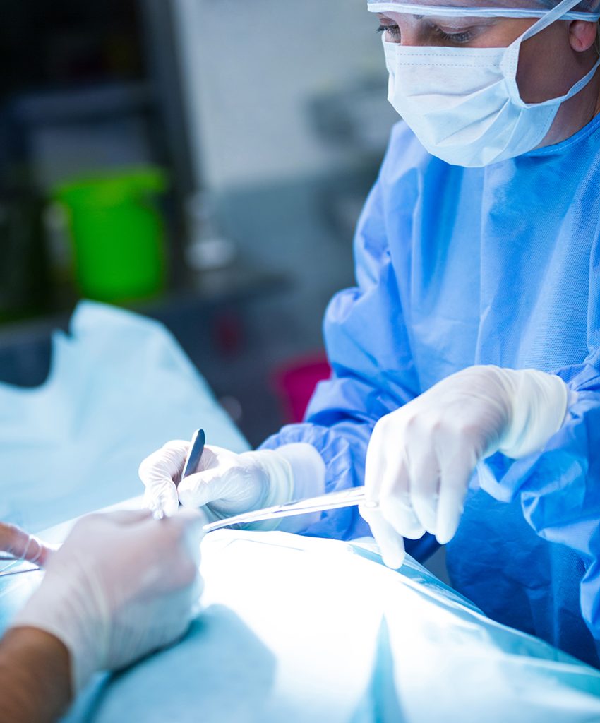 Surgeons performing operation in operation room
